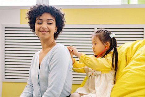 a person and a child playing doctor